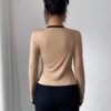 A Two-Piece Set for Women Featuring an Elegant And Stylish Color-Block Cardigan Paired with a Strapless Top