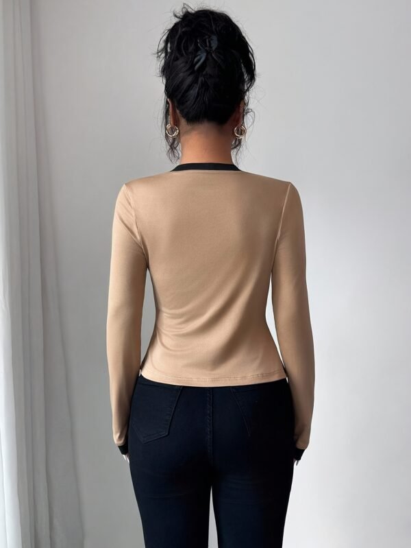 A Two-Piece Set for Women Featuring an Elegant And Stylish Color-Block Cardigan Paired with a Strapless Top